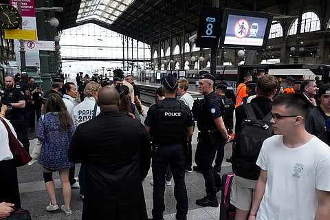 Police patrol inside the Gare du Nord train station